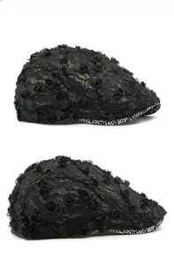 Detailed side view of a black lace beret with delicate 3D floral mesh and floral brim lining