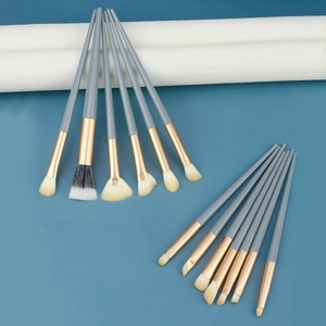 Professional 13-piece eye makeup brush set with gray handles and gold metal ferrules