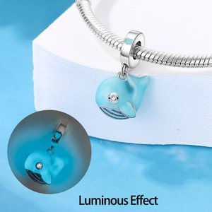 Luminous light blue whale charm bead with silver snake chain and glow-in-the-dark effect