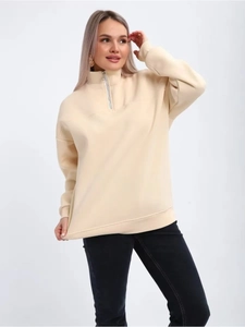 Women's apricot half-zip pullover sweatshirt in soft knit fabric with a standing collar
