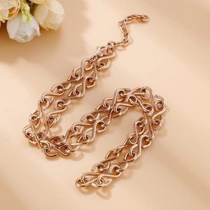 Detail of rose gold infinity link necklace featuring adjustable chain and lobster clasp