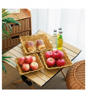 Detail of woven plastic fruit baskets with wavy edges in a natural brown finish