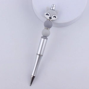 Detail of grey fox silicone bead on silver metal beaded pen with rhinestone accents
