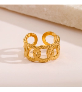 Close-up of golden adjustable chain ring featuring vintage hammered texture finish