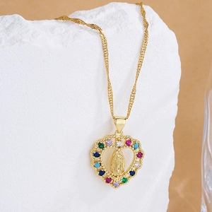Golden heart necklace with figure relief and colorful zircon pendant on stone