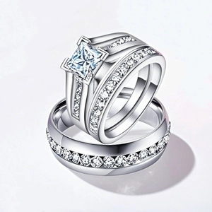 Close-up of silver-tone bridal ring set with square zircon and matching eternity band