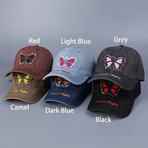 Distressed denim baseball cap with bow embroidery and Free Flight lettering brim