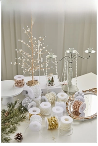 Macro view of assorted Christmas pearl beads chain on spools for DIY festive decoration