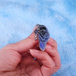 Glittery enamel crow brooch with silver cross key pendant in starry blue and purple