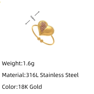 Detail of 316L stainless steel 18K gold ring with pink heart stone and bead texture