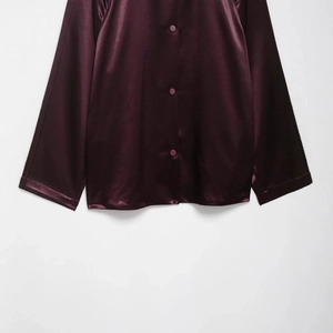 Luxurious satin jacket for women in deep wine red with silky finish and button details