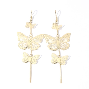 Elegant gold hollow butterfly dangle earrings with long metal tassels on white background