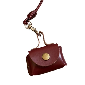 Vintage dark red leather mini coin purse necklace with metal snap button and woven lanyard