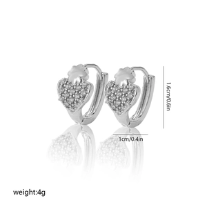 Detailed size view of silver heart hoop earrings with pave-set cubic zirconia stones