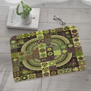 Detail of square flannel mat with ethnic mandala and geometric pattern on grey floor