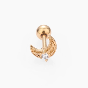 Macro view of gold crescent moon cartilage stud with grain texture and clear zircon stone
