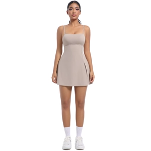 Front view of khaki athletic tennis dress featuring thin straps and a slim A-line silhouette
