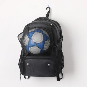 Detail of sports backpack showing front mesh pocket for ball and breathable shoe compartment