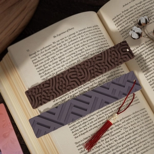 3D geometric silicone bookmark molds featuring intricate patterns and silk tassels for DIY