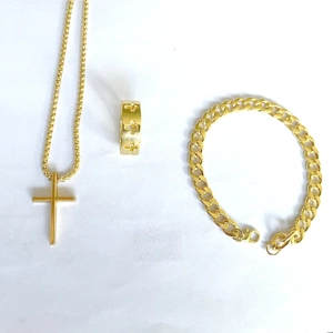 Detailed set of gold cross necklace, engraved ring and chunky curb chain bracelet