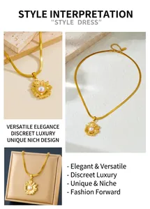 Macro detail of sunflower pendant with white pearl on golden blade snake chain necklace