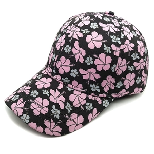 Close-up of floral print patterns and stitching on a dark baseball cap fabric