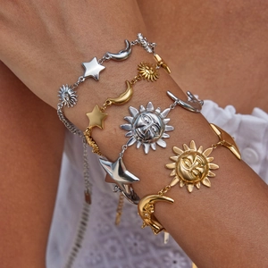 Minimalist celestial charm bracelets with gold and silver sun moon and star motifs