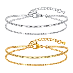 Set di bracciali a doppio strato in oro e argento con catena a serpente e chiusura a moschettone