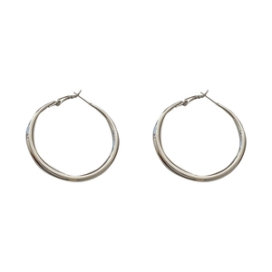 Polished silver geometric hoop earrings in a minimalist oversized circular design