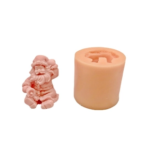 Sitting Santa Claus silicone mold for DIY candles and plaster decorations on white background