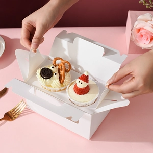 White 2-slot cupcake box with clear window and handle on a pink dessert table