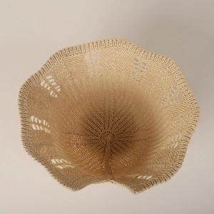 Women's beige hollow knit straw hat with scalloped brim and breathable dome shape