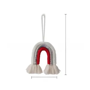 Detailed macro view of woven rainbow Christmas ornament with dimensions 13cm by 5cm