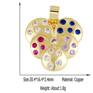 Detailed view of flower-shaped copper pendant with colorful zircon stones in gold finish