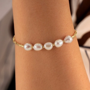 Elegant S925 sterling silver bracelet with five white freshwater pearls on a gold chain