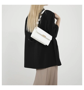 White crossbody square bag featuring a unique shell acrylic chain strap detail