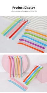 Multi-colored pet toothbrushes with angled heads on decorative trays for cats and dogs