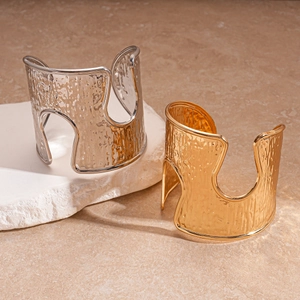 Minimalist wide open cuff bracelet with hammered metal texture in gold and silver finish