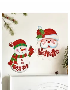 Glittery Christmas wall decals featuring Santa and Snowman on a white festive mantle