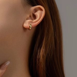 Elegant gold S925 sterling silver hoop earrings with zircon stones worn by a model