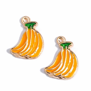 Detail of yellow enamel banana charms with green stems and golden alloy frames