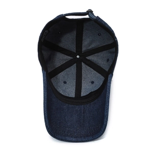 Internal view of a vintage dark blue denim baseball cap with reinforced seams and cotton label
