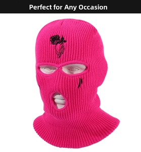 Close-up of rose embroidery on a three-hole pink knitted balaclava ski mask