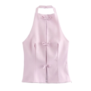 Pink halter neck top with sweet bow decorations and tie-back design in a flat lay view