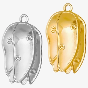 Close-up of elegant gold and silver bud-shaped stainless steel charms for DIY jewelry