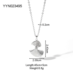 Detailed view of silver ginkgo leaf pendant with precise measurements and texture