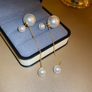 Elegant gold plated dual-wear pearl drop earrings displayed in a luxury jewelry gift box