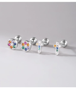 Detail of 925 silver cross and round studs with rainbow cubic zirconia and screw backs
