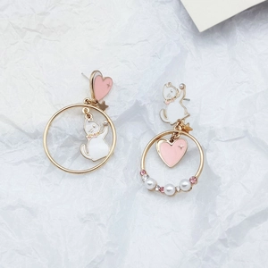 Asymmetric cat and heart earrings with pearls and pink gems on white background