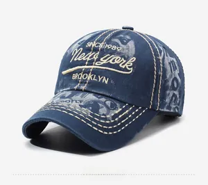 Detailed view of the 3D letter embroidery on vintage washed cotton navy baseball cap